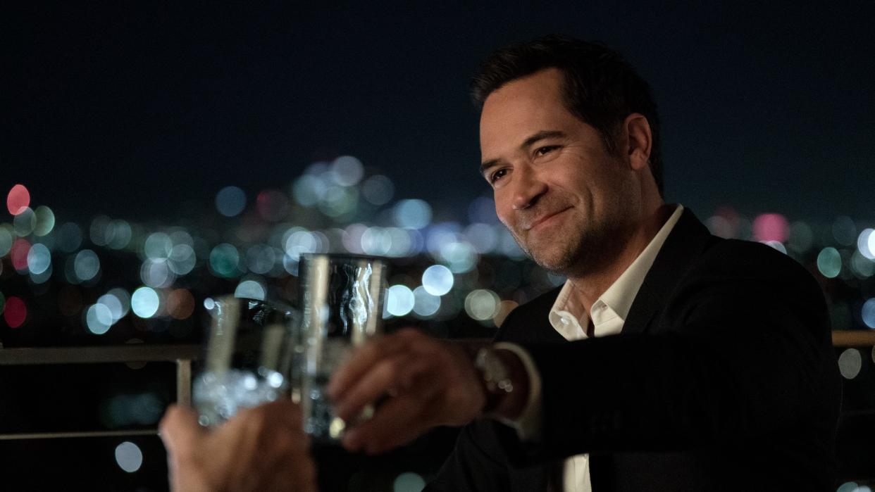  Manuel Garcia-Rulfo as Mickey Haller making a toast in The Lincoln Lawyer season 2 episode 7 