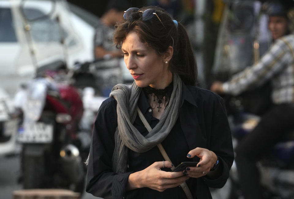 An Iranian woman without wearing her mandatory Islamic headscarf walks in downtown Tehran, Iran, Saturday, Sept. 9, 2023. Iranians are marking the first anniversary of nationwide protests over the country's mandatory headscarf law that erupted after the death of a young woman detained by morality police. (AP Photo/Vahid Salemi)