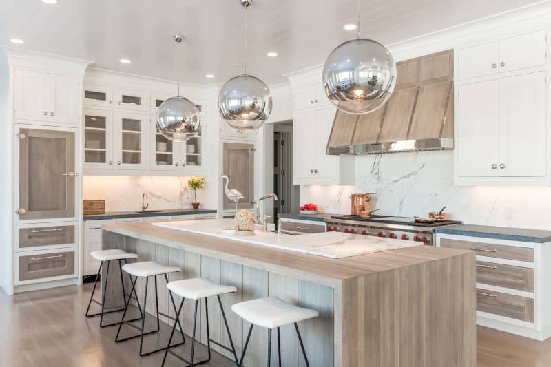 white kitchen with waterfall kitchen island