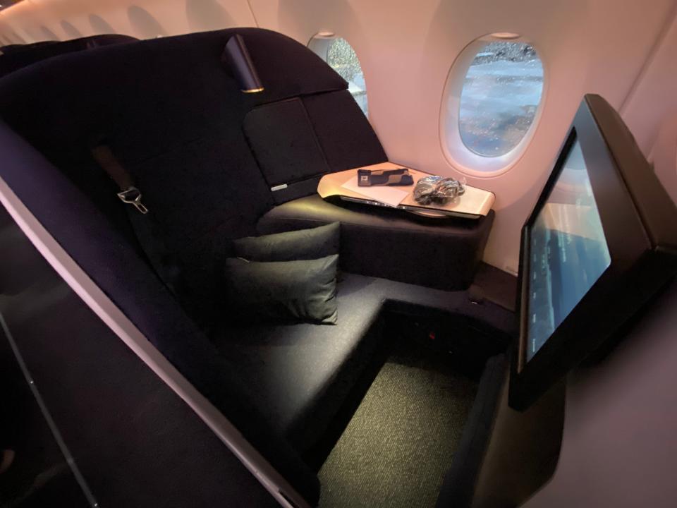View of business class seat aboard Finnair flight to Bangkok freelancer photo
