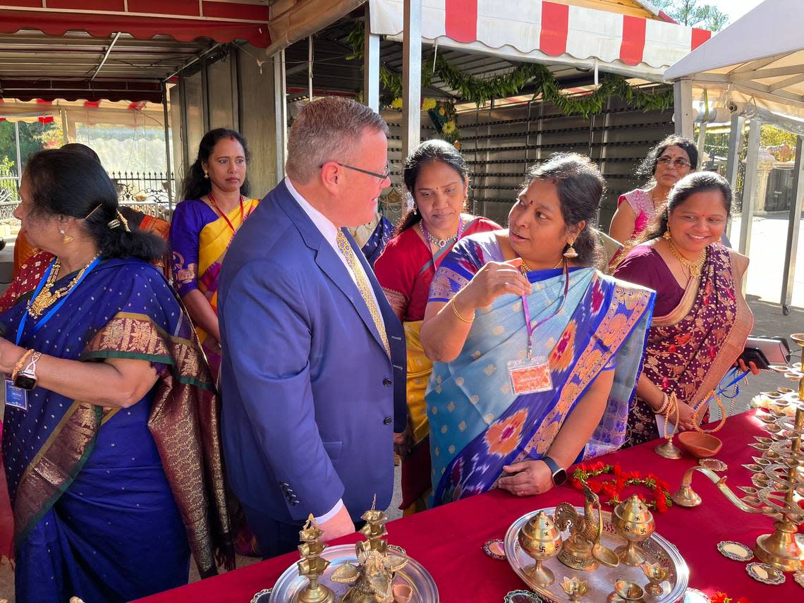 House Speaker Tim Moore talks with temple organizers preparing for the festival of Diwali during the commemoration of the Tower of Unity and Prosperity at the Sri Venkateswara Temple in Cary, N.C. on Monday, Oct. 24, 2022.