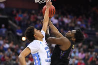 <p>Noah Dickerson #15 of Washington Huskies tries to shoot over Cameron Johnson #13 of the North Carolina Tar Heels in the second round of the 2019 NCAA Men’s Basketball Tournament held at Nationwide Arena on March 24, 2019 in Columbus, Ohio. (Photo by Jamie Schwaberow/NCAA Photos via Getty Images) </p>