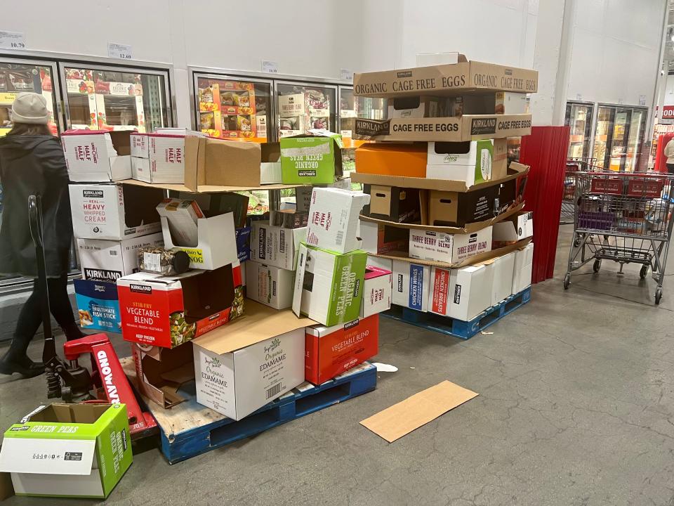 Boxes of cartons are left on the shop floor for shoppers to use.