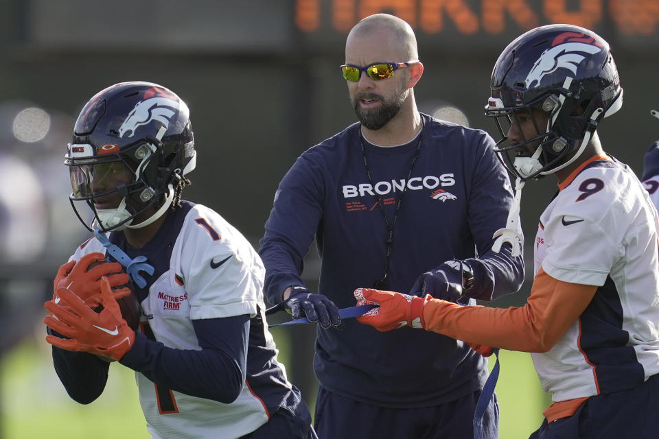Denver Broncos KJ Hamler, left, and Kendall Hinton attend a practice session in Harrow, England, Wednesday, Oct. 26, 2022 ahead the NFL game against Jacksonville Jaguars at the Wembley stadium on Sunday. (AP Photo/Kin Cheung)