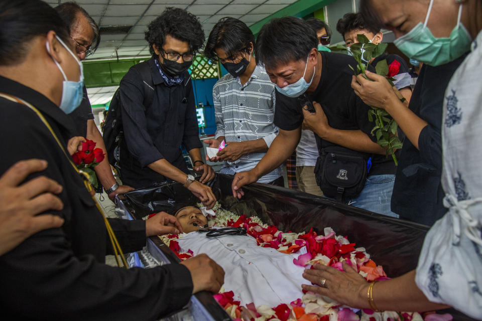 A man weeps at the funeral of Khant Ngar Hein in Yangon, Myanmar Tuesday, March 16, 2021. Khant Ngar Hein, a 18-year old student of medicine was shot on his chest on Sunday, March 14, in Tamwe, Yangon by security forces during an anti-crop protest. Demonstrators in several areas of Myanmar protesting last month’s seizure of power by the military held small, peaceful marches before dawn Tuesday, avoiding confrontations with security forces who have shot dead scores of their countrymen in the past few days.(AP Photo)