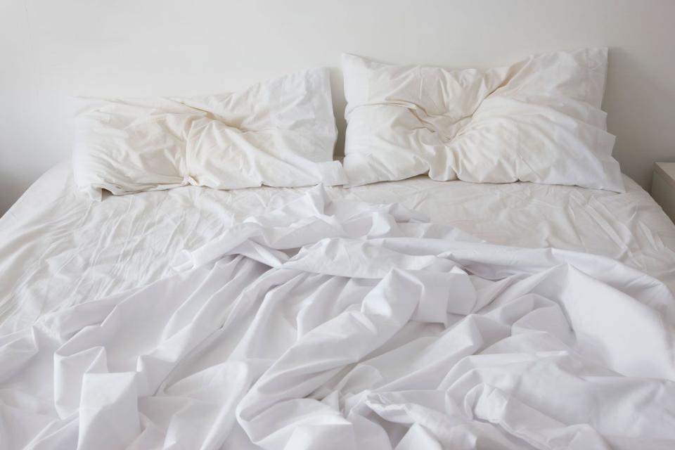 <p>Getty</p> Stock photo of an unmade bed,