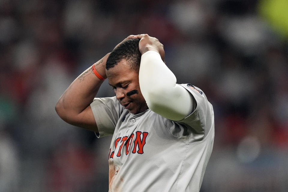 Boston Red Sox' Rafael Devers reacts after striking out in the sixth inning of a baseball game against the Atlanta Braves Tuesday, May 7, 2024, in Atlanta. (AP Photo/John Bazemore)