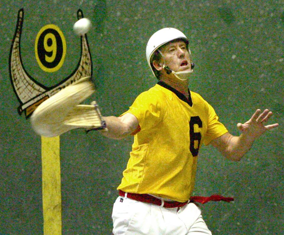 A jai alai player returns a shot during practice at Ocala Jai Alai in Orange Lake on Wednesday, April 5, 2006.