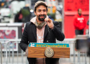 <p>Lin-Manuel Miranda takes the podium at the opening of a vaccination center for Broadway workers in N.Y.C.'s Times Square on Monday.</p>