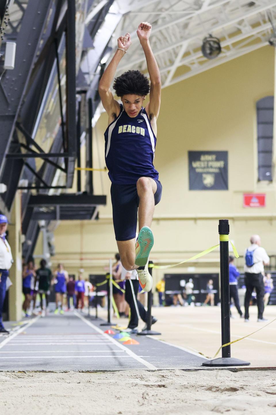 Beacon's Damani DeLoatch gives a winning performance in the triple jump in the Section 9 Class A track and field championships at West Point, NY on February 10, 2024. ALLYSE PULLIAM/For the Times Herald-Record