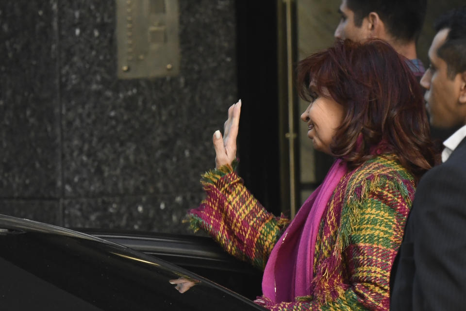 Argentine Vice President Cristina Fernandez waves to supporters as she exits her home four days after a person pointed a gun at her here in the Recoleta neighborhood of Buenos Aires, Argentina, Monday, Sept. 5, 2022. (AP Photo/Gustavo Garello)