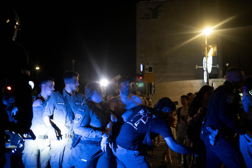 Israeli Border Police detain friends and supporters of Israeli-American hostage Hersh Goldberg-Polin, who was kidnapped on Oct. 7, 2023, during a protest near Israeli Prime Minister Benjamin Netanyahu's official residence to demand a deal for the immediate release of all hostages, after Hamas released a video of Goldberg-Polin, in Jerusalem, Wednesday, April 24, 2024. (AP Photo/Maya Alleruzzo)