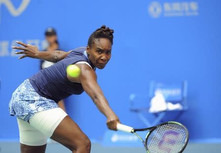 Venus Williams of the U.S. plays against Garbine Muguruza Blanco of Spain during their women's singles final match, at the Wuhan Open tennis tournament, Hubei province, October 3, 2015. REUTERS/China Daily