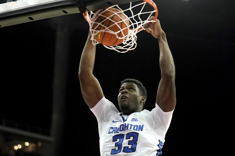 Creighton center Fredrick King (33) dunks the ball during the first half of an NCAA college basketball game against Loyola Chicago Wednesday, Nov. 22, 2023, in Kansas City, Mo. (AP Photo/Charlie Riedel)
