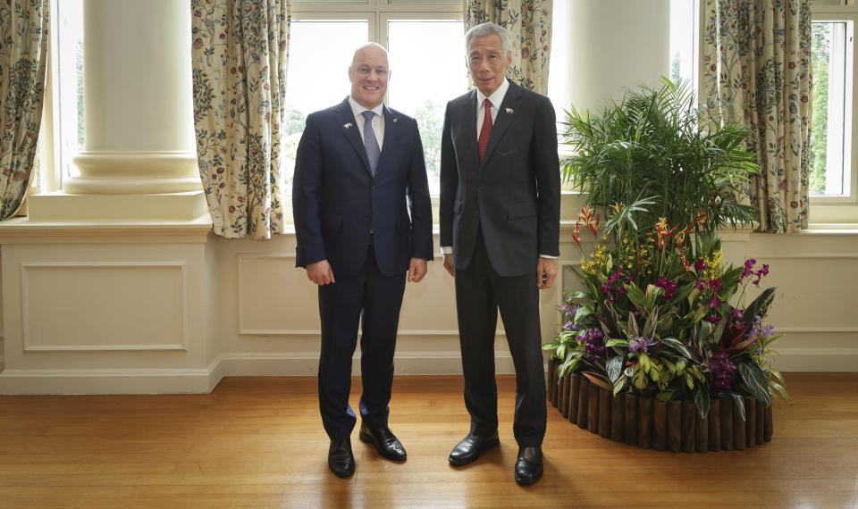 In this photo released by Singapore's Ministry of Communications and Information, New Zealand Prime Minister Luxon, left, poses for a photo with Singapore's Prime Minister Lee Hsien Loong at the Istana, Monday, April 15, 2024. (Terence Tan/Ministry of Communications and Information via AP)