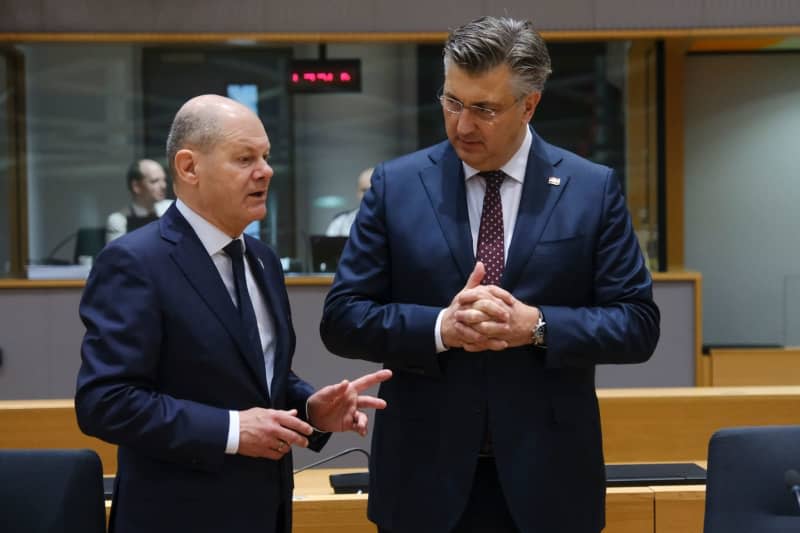 German Chancellor Olaf Scholz (L) and Croatia's Prime Minister Andrej Plenkovic attend the EU summit in Brussels. Alexandros Michailidis/European Council/dpa