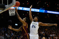 <p>Jordan Caroline #24 of the Nevada Wolf Pack goes up for a block against Aundre Jackson #24 of the Loyola Ramblers in the first half during the 2018 NCAA Men’s Basketball Tournament South Regional at Philips Arena on March 22, 2018 in Atlanta, Georgia. (Photo by Kevin C. Cox/Getty Images) </p>