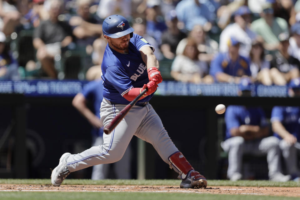 Toronto Blue Jays' Alejandro Kirk hits an RBI double against the Seattle Mariners during the fourth inning in a baseball game, Saturday, July 6, 2024, in Seattle. (AP Photo/John Froschauer)