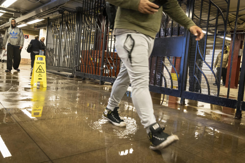 A commuter at the Bowery subway station on Manhattan's Lower East Side following heavy rains on Sept. 29.