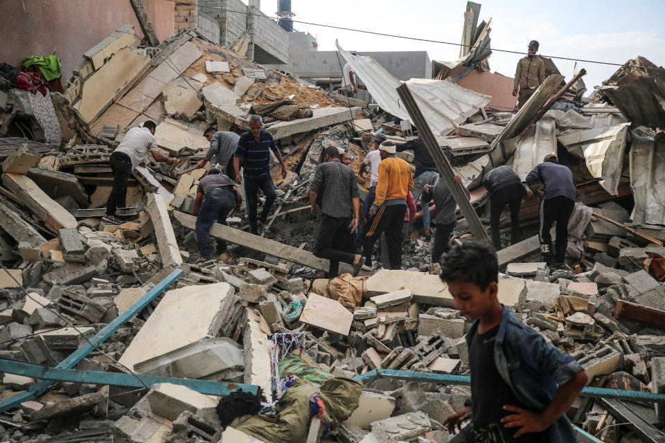 Palestinians search for casualties at the site of an Israeli airstrike on a house, amid the ongoing conflict between Israel and the Hamas militant group, in Nuseirat refugee camp, central Gaza, May 14, 2024. / Credit: Majdi Fathi/NurPhoto/Getty