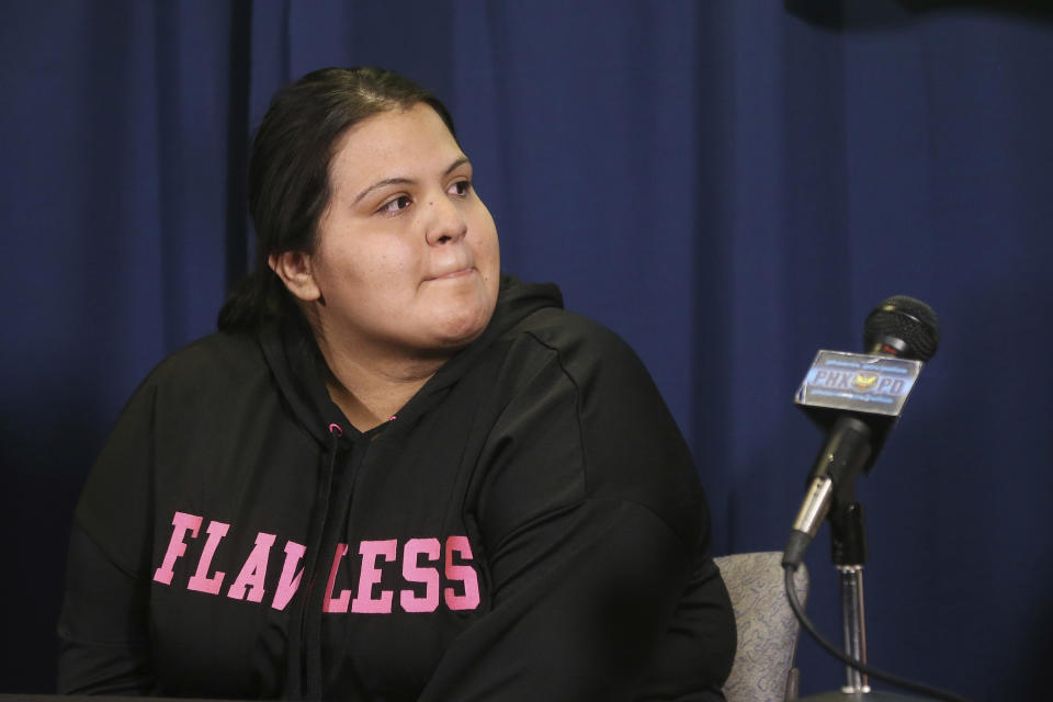 Shannon Vivar, 27, who had her car hit by a red light runner, pauses as she speaks at Phoenix Police headquarters about her ordeal Thursday, Oct. 24, 2019, in Phoenix. Authorities say 28-year-old Ernesto Otanez Oveso is accused of running a red light Oct. 14 in a hit-and-run car crash that nearly struck a couple pushing a stroller across a busy Phoenix street, and remains jailed on suspicion of leaving the scene of a collision and aggravated assault along with a weapons violation, a felony warrant in a probation violation and three misdemeanor warrants. (AP Photo/Ross D. Franklin)