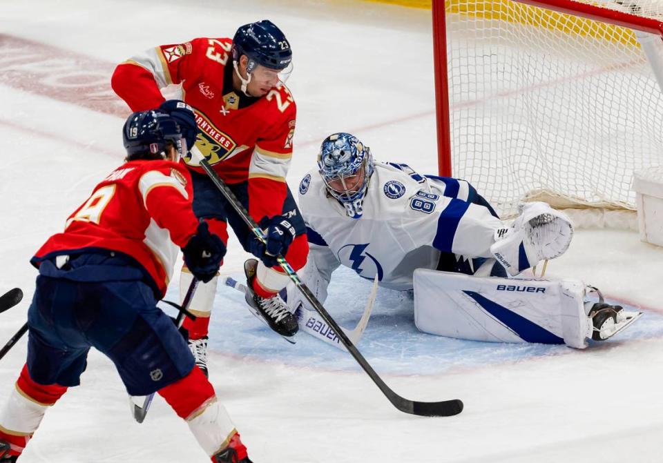 Florida Panthers center Carter Verhaeghe (23) scores a goal against Tampa Bay Lightning goaltender Andrei Vasilevskiy (88) in overtime period in Game 2 of the first-round of the 2024 Stanley Cup Playoffs at Amerant Bank Arena on Tuesday, April 23, 2024, in Sunrise, Fla. MATIAS J. OCNER/mocner@miamiherald.com