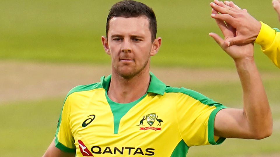 Josh Hazlewood is pictured playing for Australia.