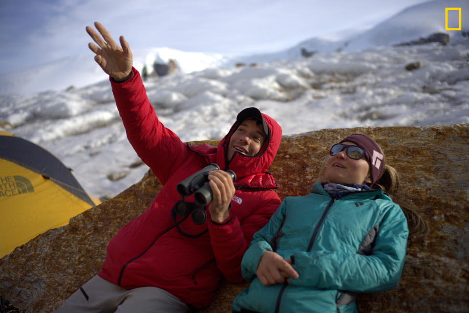Alex Honnold and Hazel Findlay in camp at the base of Ingmikortilaq talking about possible climbing routes. They summited on August 16, 2022 Alex Honnold and Hazel Findlay summited Ingmikortilaq (Ing-mik-or-tuh-lack), which in Greenlandic means Òthe separate oneÓ Ð the formation is named after the peninsula on which it is located. The buttress rises out of the icy waters of Nordvestfjord in the islandÕs Scoresby sound region of Greenland.  Credit: Photograph by J.J. Kelley, National Geographic for Disney+