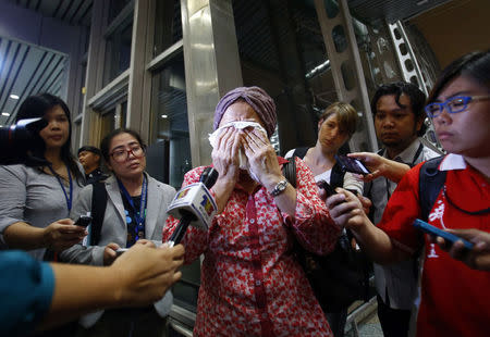 A woman, who said her name was Noraini and that she believed a relative of hers was on Malaysia Airlines flight MH-17, cries as she waits for more information about the crashed plane, at Kuala Lumpur International Airport in Sepang July 18, 2014. REUTERS/Samsul Said