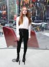 <p>Sadie Sink in an Alexander Wang button-up, black pants, and combat boots.</p>