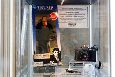 A Donald J. Trump 12” talking doll, Trump Plaza camera, Doral Golf Resort & Spa golf ball and a divot tool from Briarcliff Manor are displayed at The Trump Museum near the Republican National Convention in Cleveland, Ohio, U.S., July 19, 2016. REUTERS/Lucas Jackson