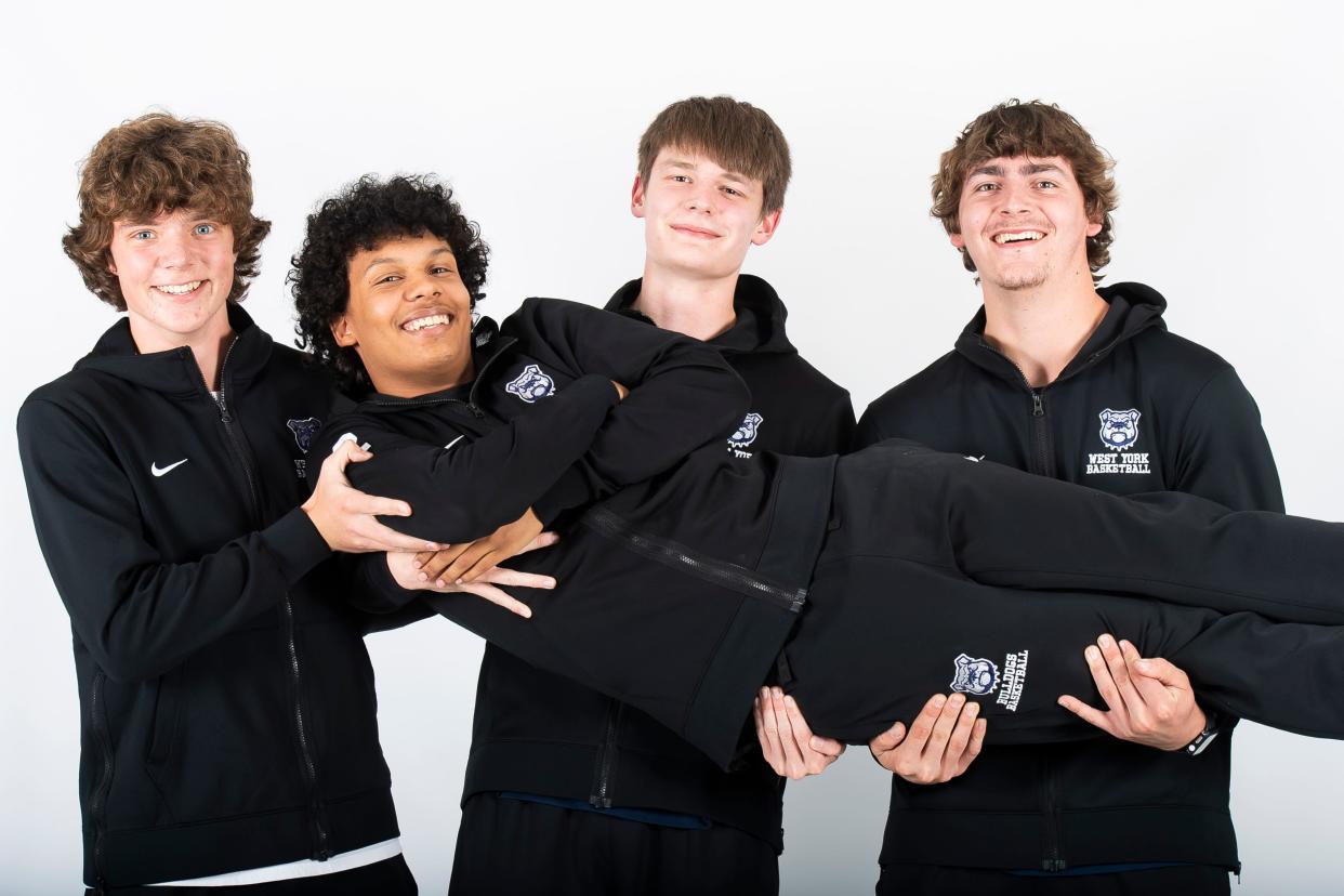 (From left) West York basketball players Brendan Kern, Mark Walker, Kevin Rill and Jacob Knisley pose for a group photo during YAIAA winter sports media days Wednesday, November 8, 2023, in York.