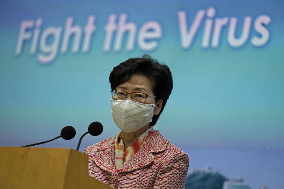 Hong Kong Chief Executive Carrie Lam listens to a reporter's questions during a press conference in Hong Kong, Tuesday, Sept. 22, 2020. Lam said the semi-autonomous Chinese territory has seen its image damaged in the international arena following China’s imposition in June of a sweeping national security law demanding total loyalty to China’s ruling Communist Party. Lam declined to comment directly to reporters on the reasons behind the resignation of an Australian judge on Hong Kong’s top court that has raised the questions about the future of judicial independence in the territory. (AP Photo/Vincent Yu)