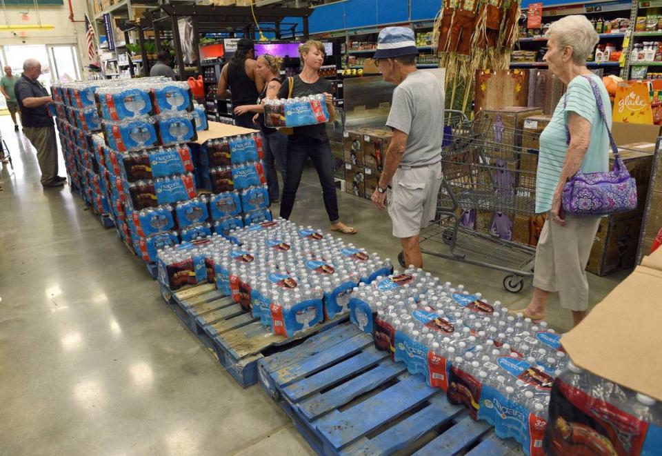 Customers load up on water and other supplies at Bradenton’s Lowes Tuesday as residents prepare for the approach of Hurricane Irma Tuesday.