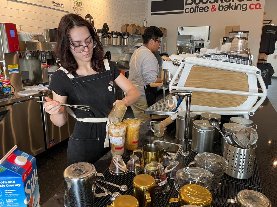 Desiree Sams makes tumeric tea for a customer at Booskerdoo Coffee & Baking Co. in Middletown on May 9. 2023.