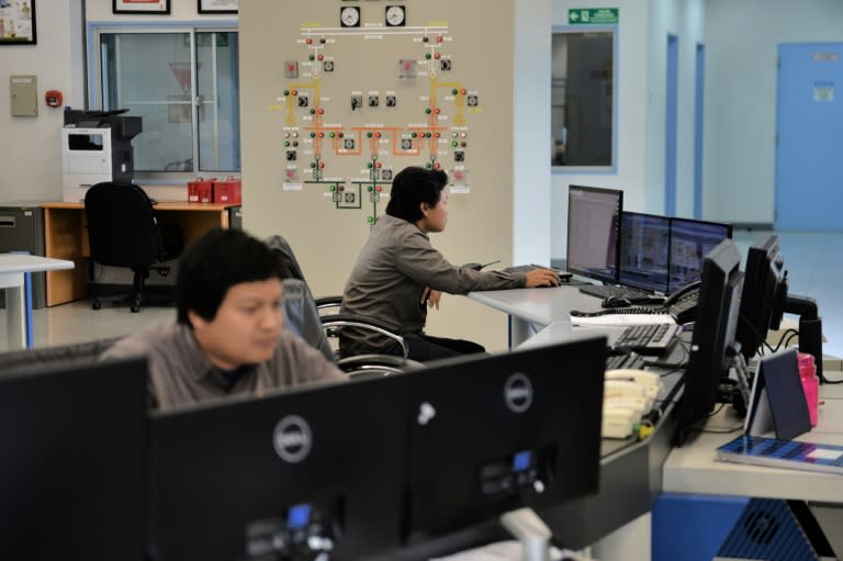 Plant controllers working in the control room of the Wayang Windu geothermal power station on West Java