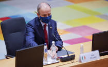 Ireland's Prime Minister Micheal Martin attends a round table meeting at an EU summit in Brussels, Friday, Oct. 22, 2021. European Union leaders conclude a two-day summit on Friday in which they discussed issues such as climate change, the energy crisis, COVID-19 developments and migration.(AP Photo/Olivier Matthys, Pool)