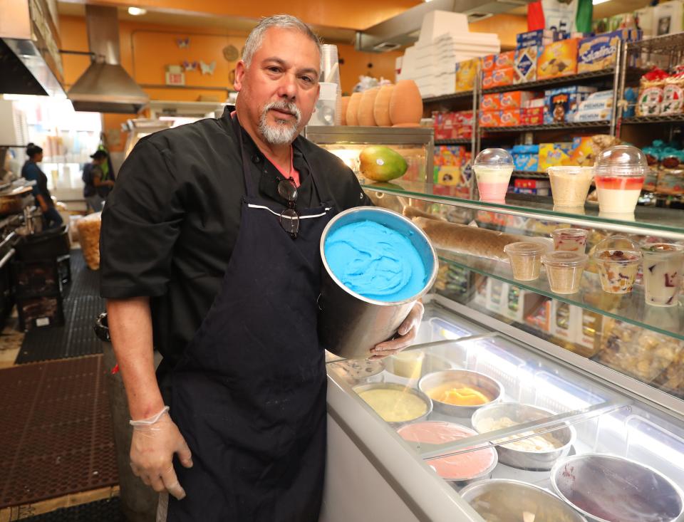 Sergio Hernandez, holds a tub of homemade Mexican ice cream (bubble gum) at Mercado Hernandez on Union Avenue in New Rochelle, Sept. 30, 2022.