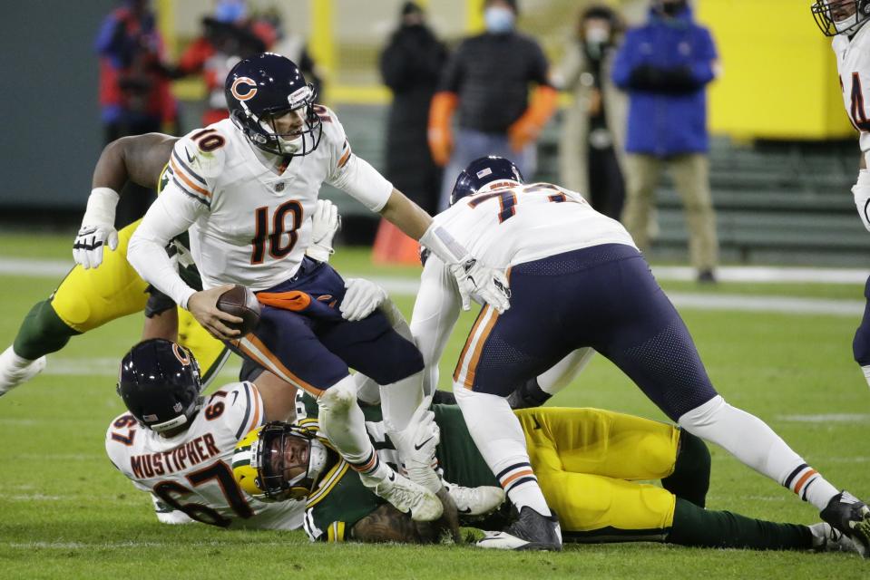 Chicago Bears' Mitchell Trubisky is sacked by Green Bay Packers' Preston Smith during the second half of an NFL football game Sunday, Nov. 29, 2020, in Green Bay, Wis. (AP Photo/Mike Roemer)