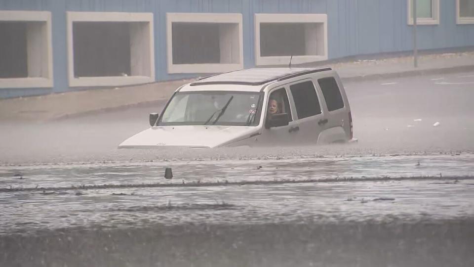 Driver trapped in flood waters on Parker Street in Lawrence