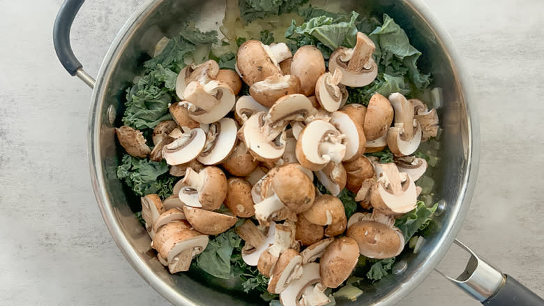 mushrooms and kale in skillet