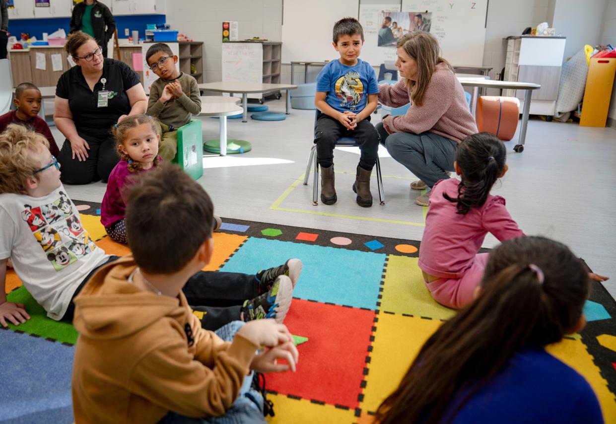 Teresa Miller calms Israel Maldanado, a student in her transitional kindergarten class at Early Elementary School in Storm Lake, Tuesday, Nov. 28, 2023.