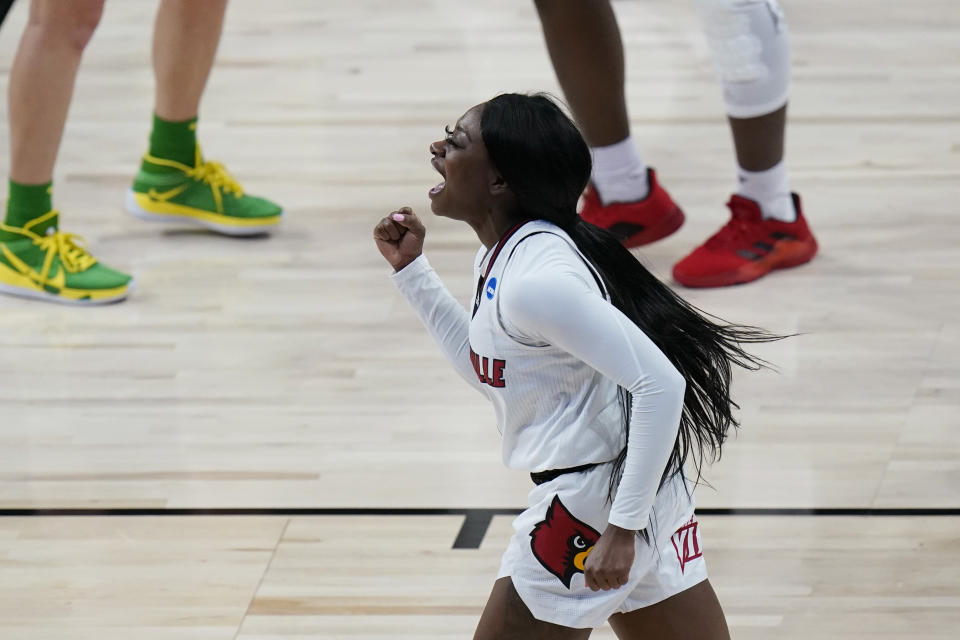 Louisville guard Dana Evans (1) celebrates a score against the Oregon during the first half of a college basketball game in the Sweet Sixteen round of the women's NCAA tournament at the Alamodome in San Antonio, Sunday, March 28, 2021. (AP Photo/Eric Gay)