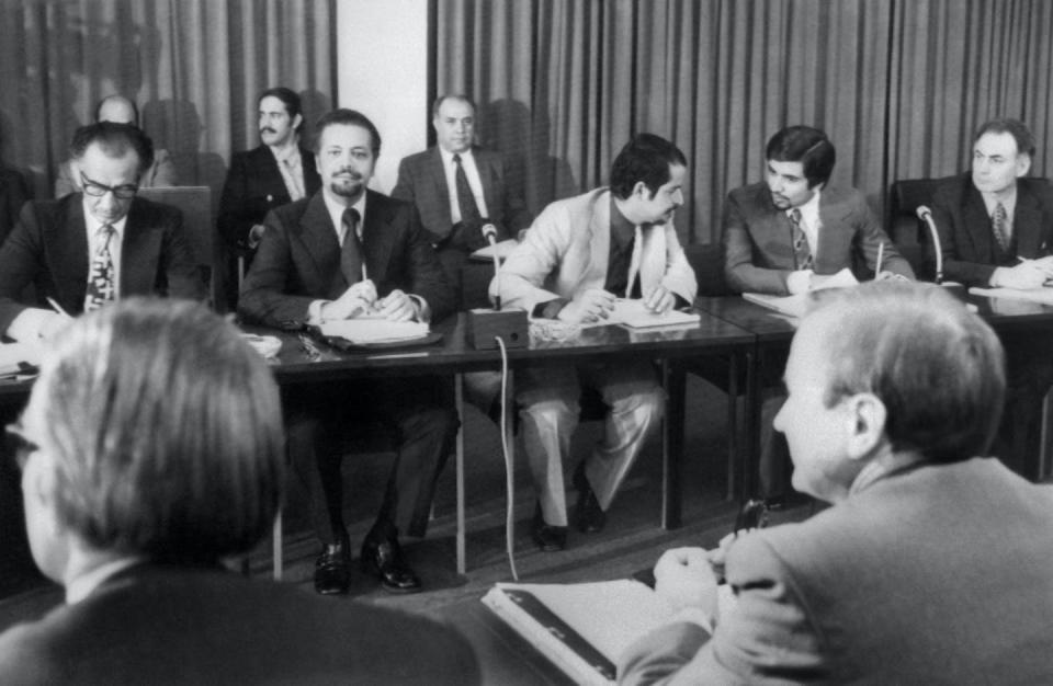 Saudi oil minister Ahmed Zaki Yamani, second from left at the table, negotiated a deal that shifted control of Arabian American Oil Company from Exxon, Chevron, Mobil and Texaco to Saudi Arabia. Saudi Aramco is now the world’s largest oil producing company. <a href="https://www.gettyimages.com/detail/news-photo/picture-taken-08-october-1973-in-vienna-showing-the-news-photo/97661766?adppopup=true" rel="nofollow noopener" target="_blank" data-ylk="slk:AFP via Getty Images;elm:context_link;itc:0;sec:content-canvas" class="link ">AFP via Getty Images</a>