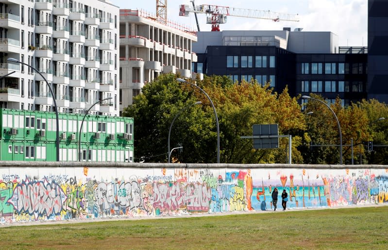 FILE PHOTO: New apartment and office buildings are pictured beside the East Side Gallery in Berlin