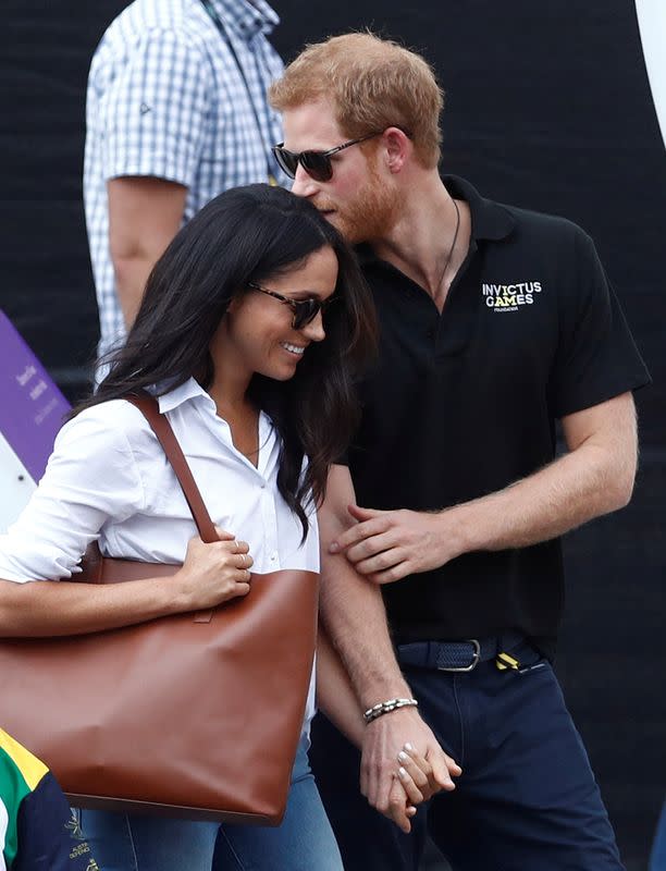 FILE PHOTO: Britain's Prince Harry arrives with girlfriend Markle at the wheelchair tennis event during the Invictus Games in Toronto