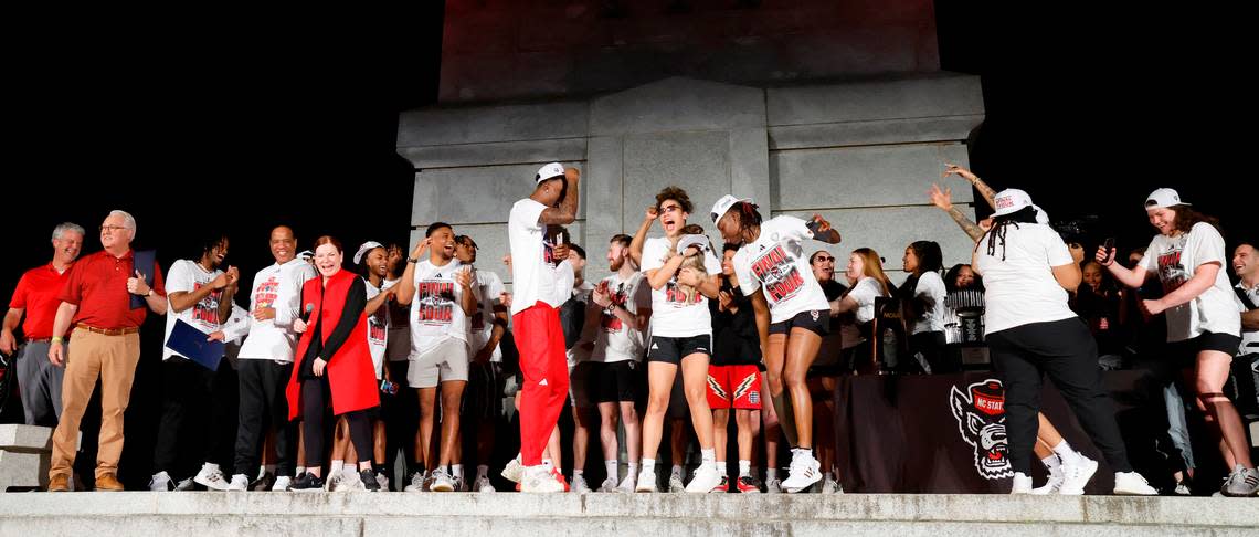 Members of the men’s and women’s basketball team celebrate at the end of a ceremony for the teams at the Memorial Belltower in Raleigh, N.C., Monday, April 15, 2024. Both teams made it to the NCAA Tournament Final Four and the men’s team won the ACC Championship by winning five games in five days.