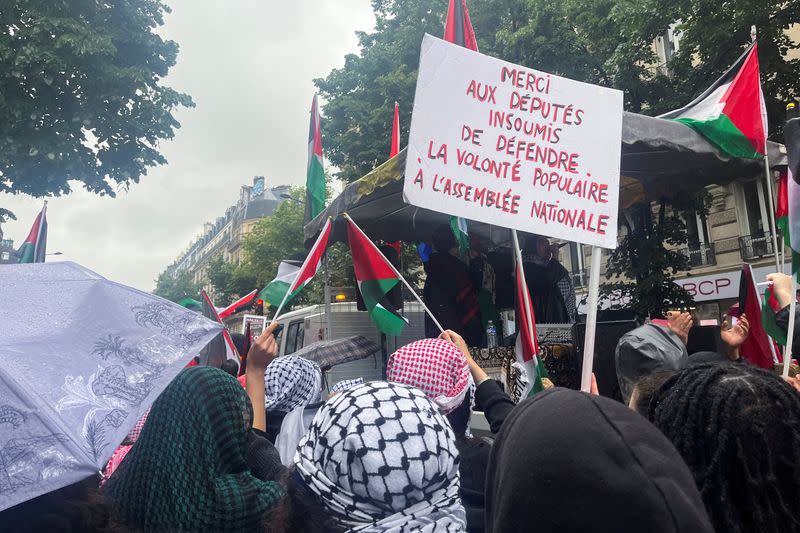 Sign displayed in reference to LFI at pro-Palestinian protest in Paris