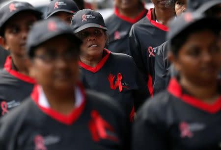 A group of women march during an event to mark the World AIDS day in Colombo, Sri Lanka December 1, 2016. REUTERS/Dinuka Liyanawatte