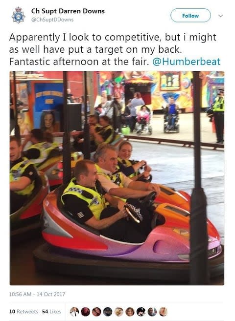 Chief Superintendent Darren Downs posted this picture of himself with colleagues on the dodgems - Credit: ChSuptDDowns/Twitter